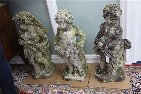 A set of eight reconstituted stone figures of putti holding vines, floral swags and other foliate motifs, H. 2ft 4in.